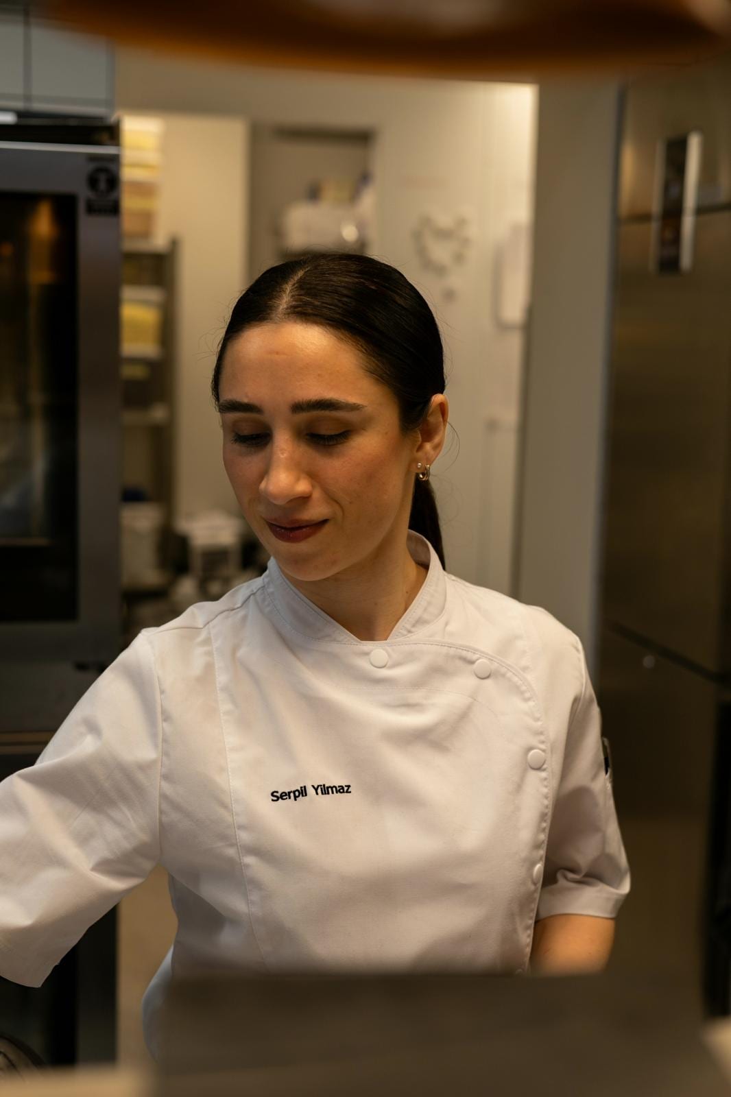 Chef Serpil Yilmaz-Rantanen portrait in a professional kitchen