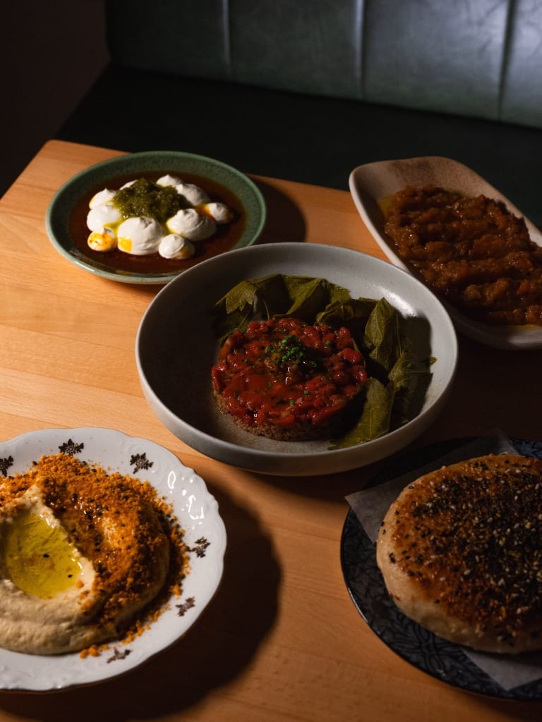A colorful selection of Anatolian meze dishes on a wooden table