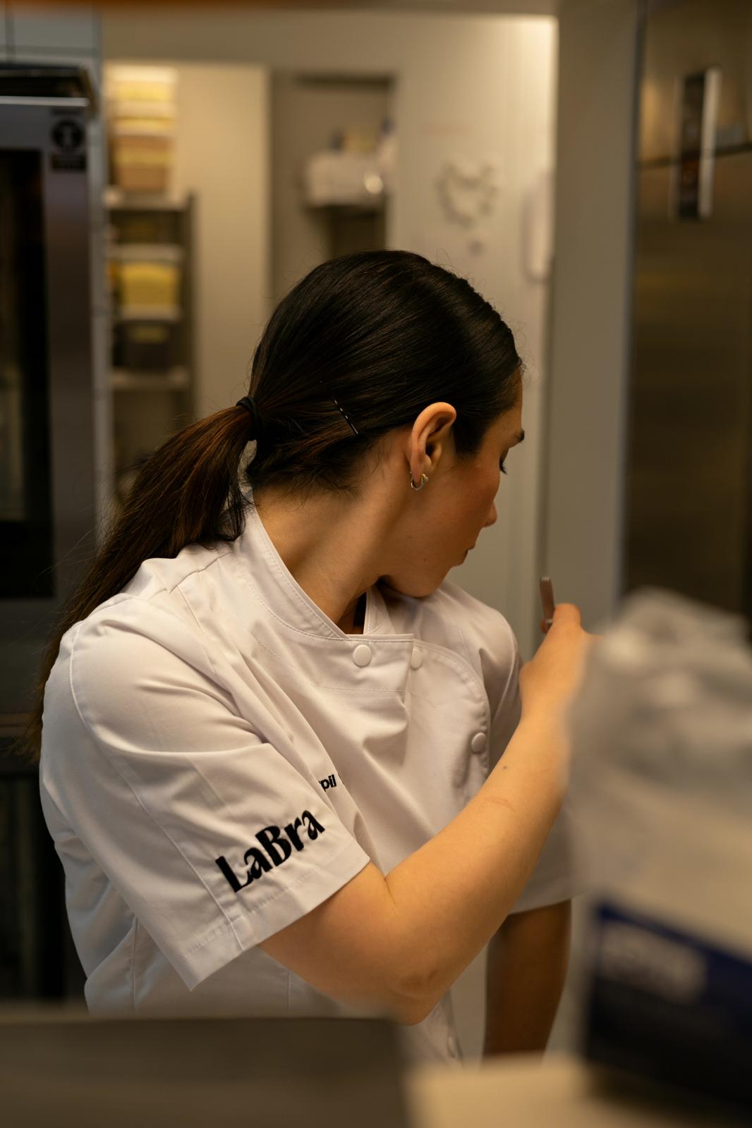 Chef Serpil Rantanen preparing food in a professional kitchen